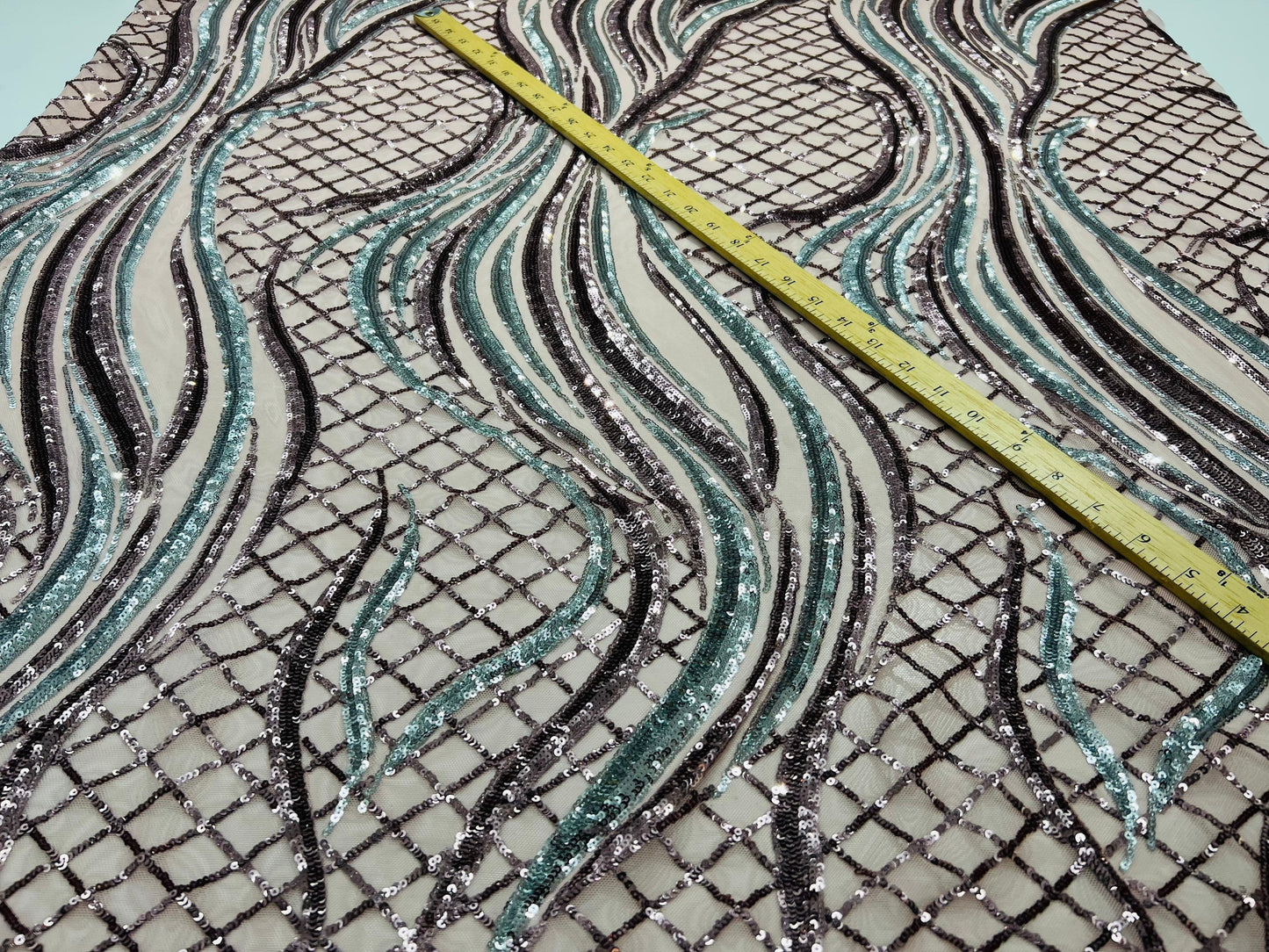 New Luxury abstract design embroidered sequins on stretch mesh 2-way stretch 55/57” Sold by the YD. Ships Worldwide from Los Angeles CA