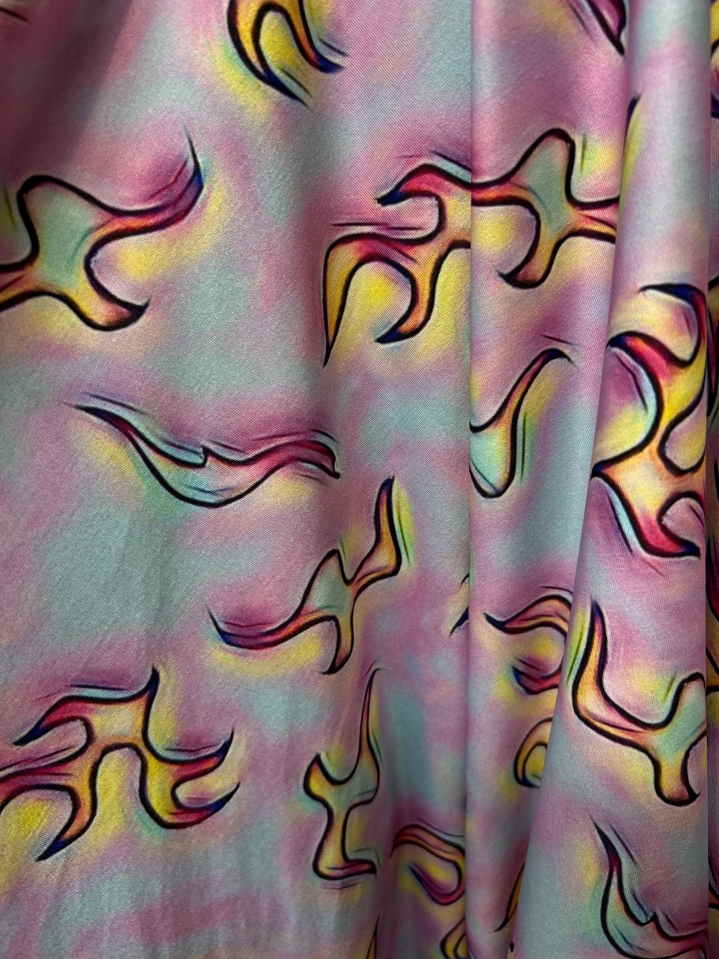 Flames design Multicolor print on poly spandex 4-way stretch 58/60” Sold by the YD. Ships Worldwide from Los Angeles California USA.