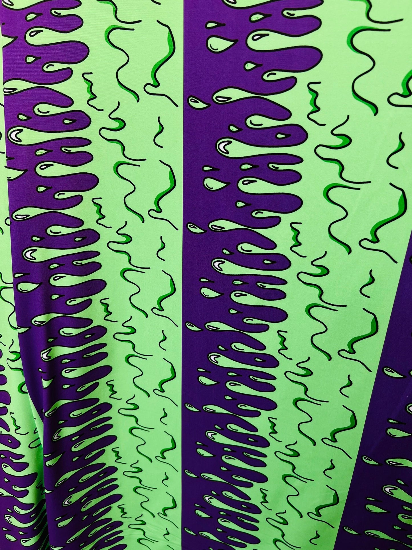Abstract design green/purple print on great quality of poly spandex 4-way stretch 58/60” Sold by the YD. Ships Worldwide from Los Ángeles CA