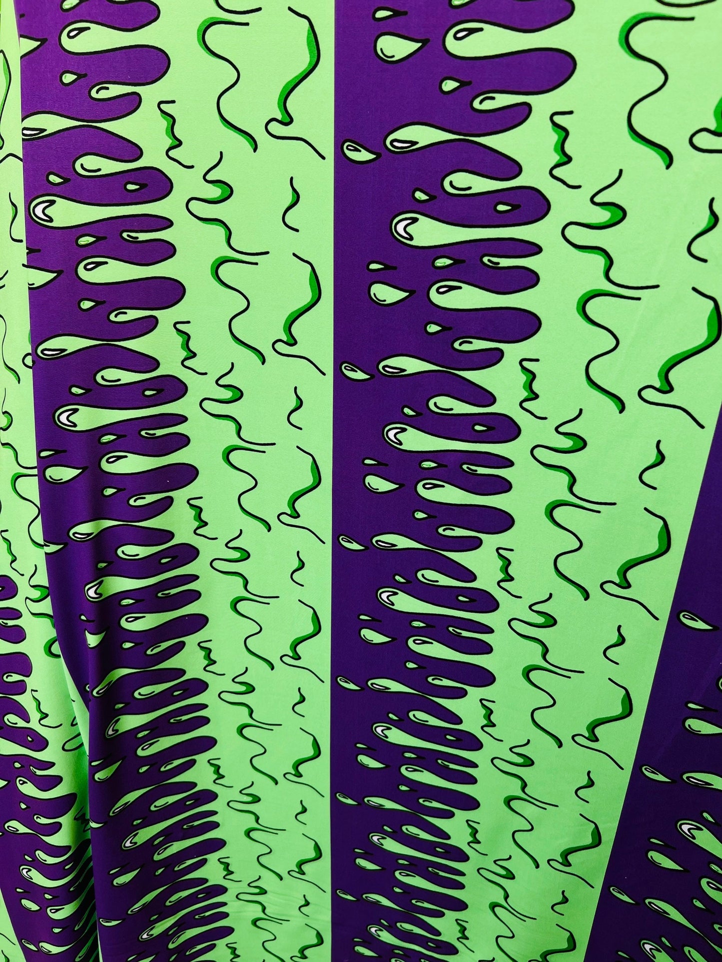 Abstract design green/purple print on great quality of poly spandex 4-way stretch 58/60” Sold by the YD. Ships Worldwide from Los Ángeles CA