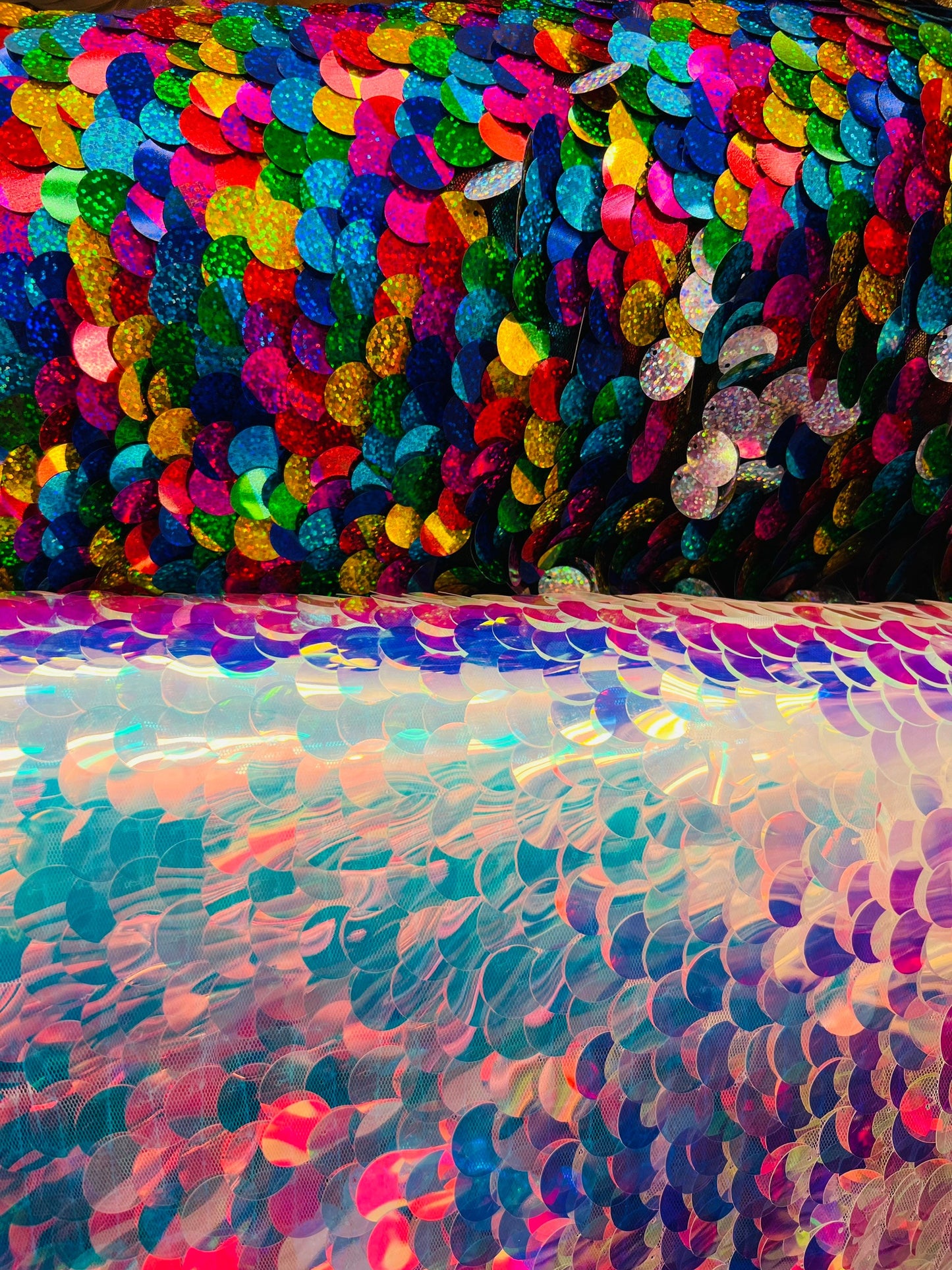 Paillette circle white iridescent and multi color sequins on stretch mesh base. Sold by the yd ships worldwide