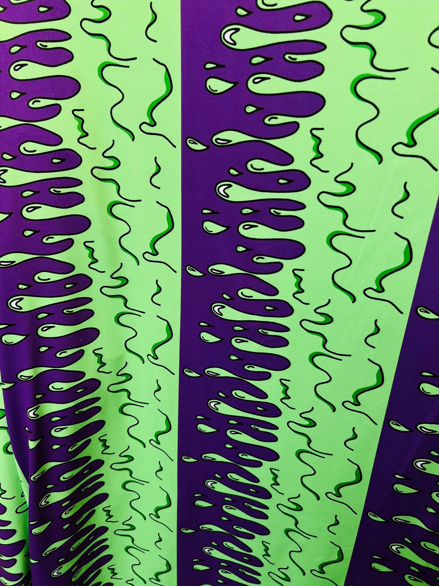 Abstract design green/purple print on great quality of poly spandex 4-way stretch 58/60” Sold by the YD. Ships Worldwide from Los Ángeles CA
