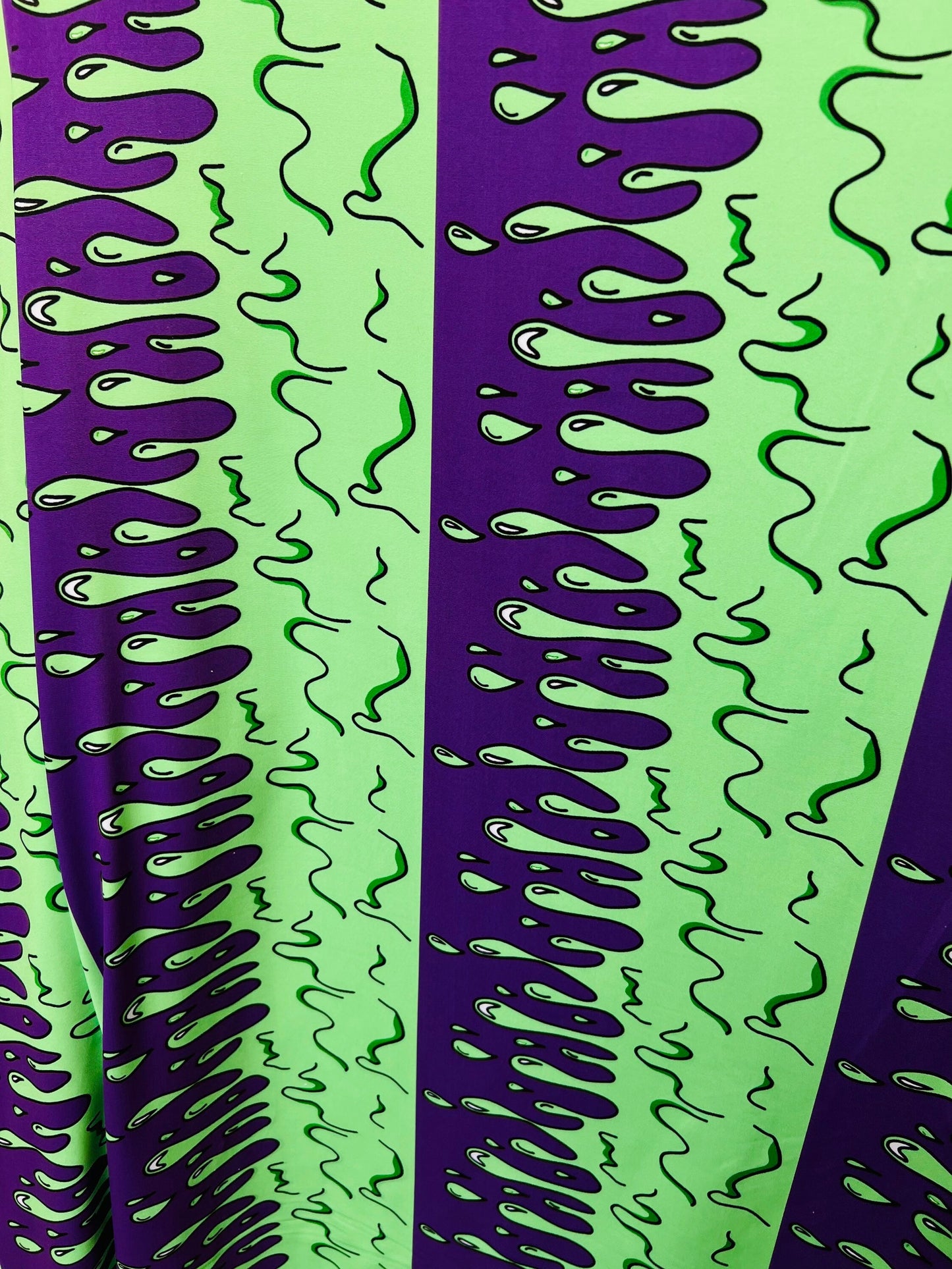 Abstract design green/purple print on great quality of poly spandex 4-way stretch 58/60” Sold by the YD. Ships Worldwide from Los Ángeles CA