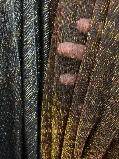 Pleated metallic stretch mesh 4way stretch 58/60” Sold by the YD. Ships worldwide from Los Angeles California USA.