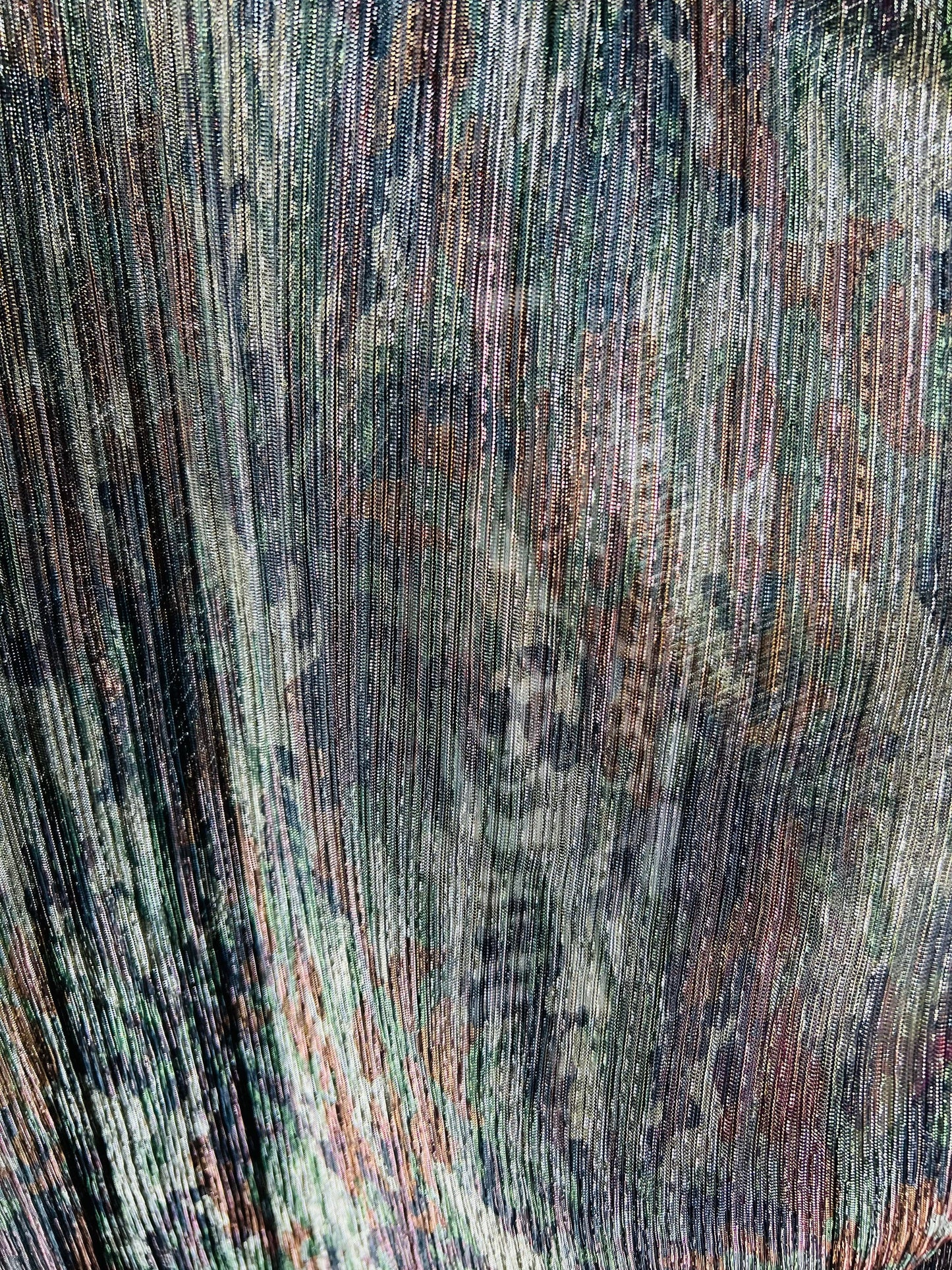 New camouflage design print on metallic mesh pleated 2-way stretch 58/60” Sold by the YD. Ships Worldwide from Los Angeles California USA.