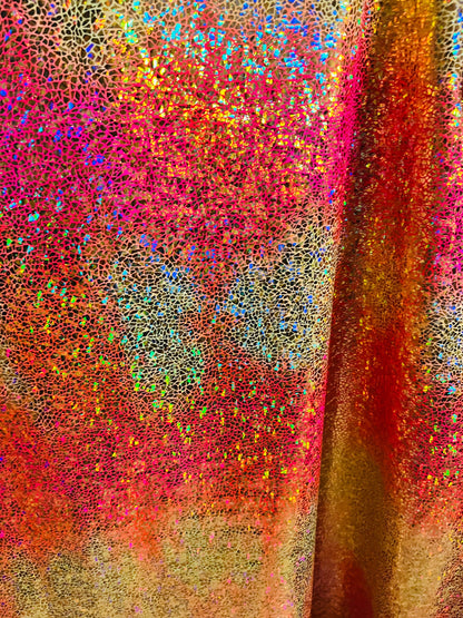 Hologram pebbles design metallic tie dye nylon spandex with foil 4-way stretch 58/60” Sold by the YD. Ships Worldwide from Los Ángeles CA