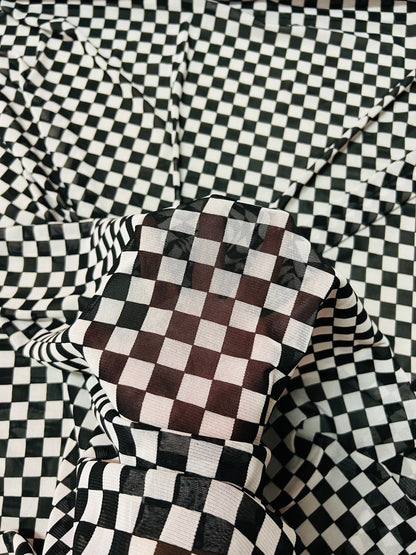 Checkers design White/Black print on great quality of power mesh 2-way stretch 58/60” Sold by the YD. Ships Worldwide from Los Angeles Cali