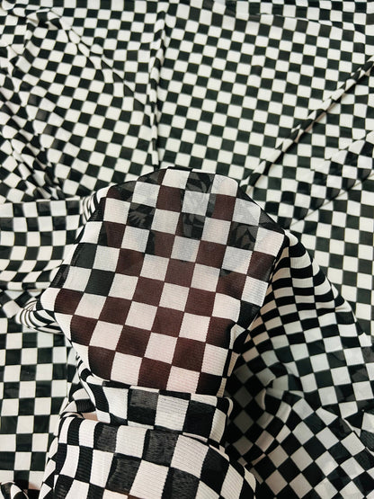 Checkers design White/Black print on great quality of power mesh 2-way stretch 58/60” Sold by the YD. Ships Worldwide from Los Angeles Cali