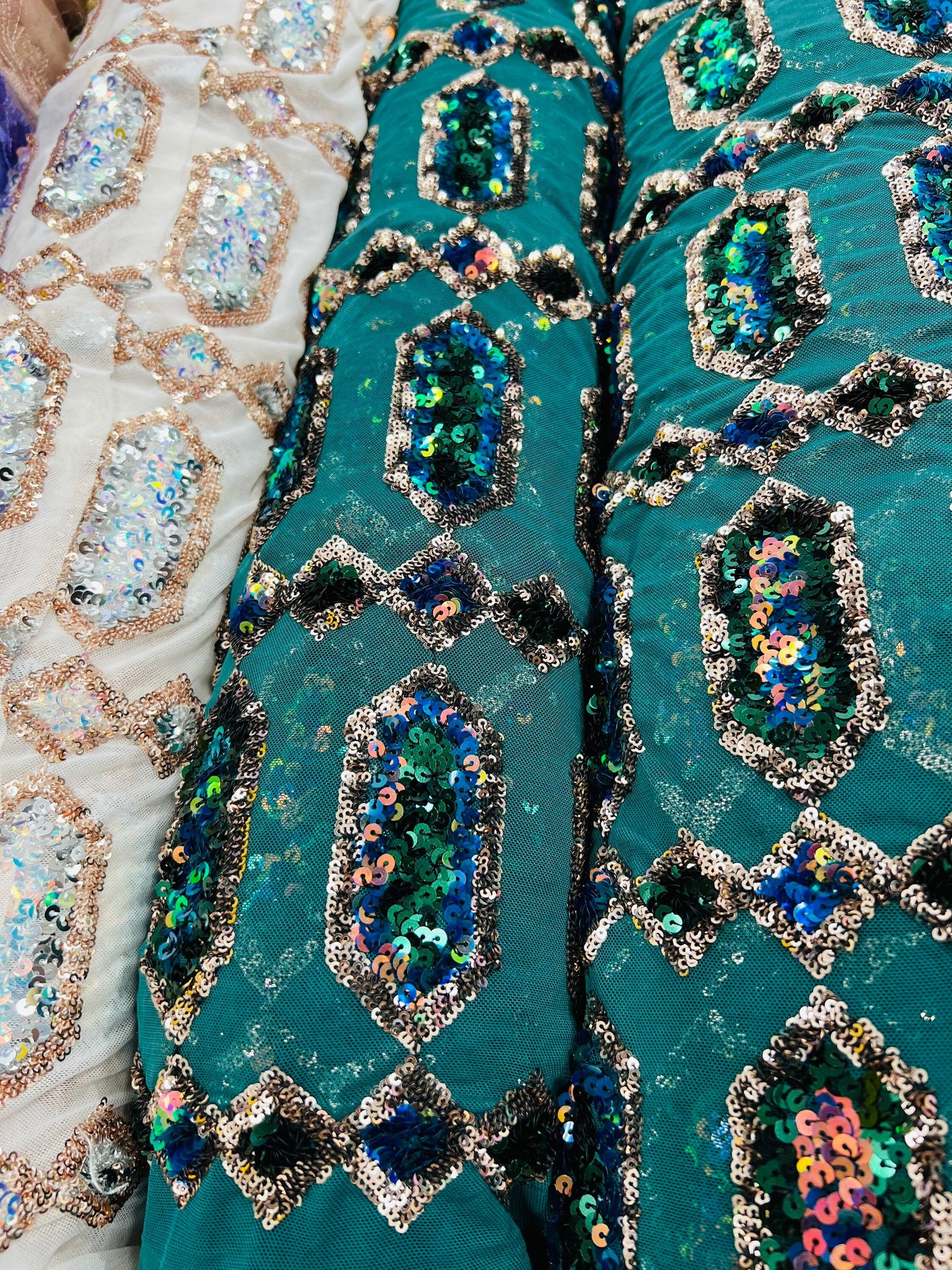 Luxury Geometric Iridescent sequins on stretch mesh 2-way 50/52” Sold by the YD. Ships worldwide from Los Angeles California USA.