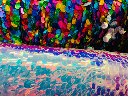 Paillette circle iridescent and multi sequins on stretch mesh base. Sold by the yd ships worldwide from Los Angeles CA