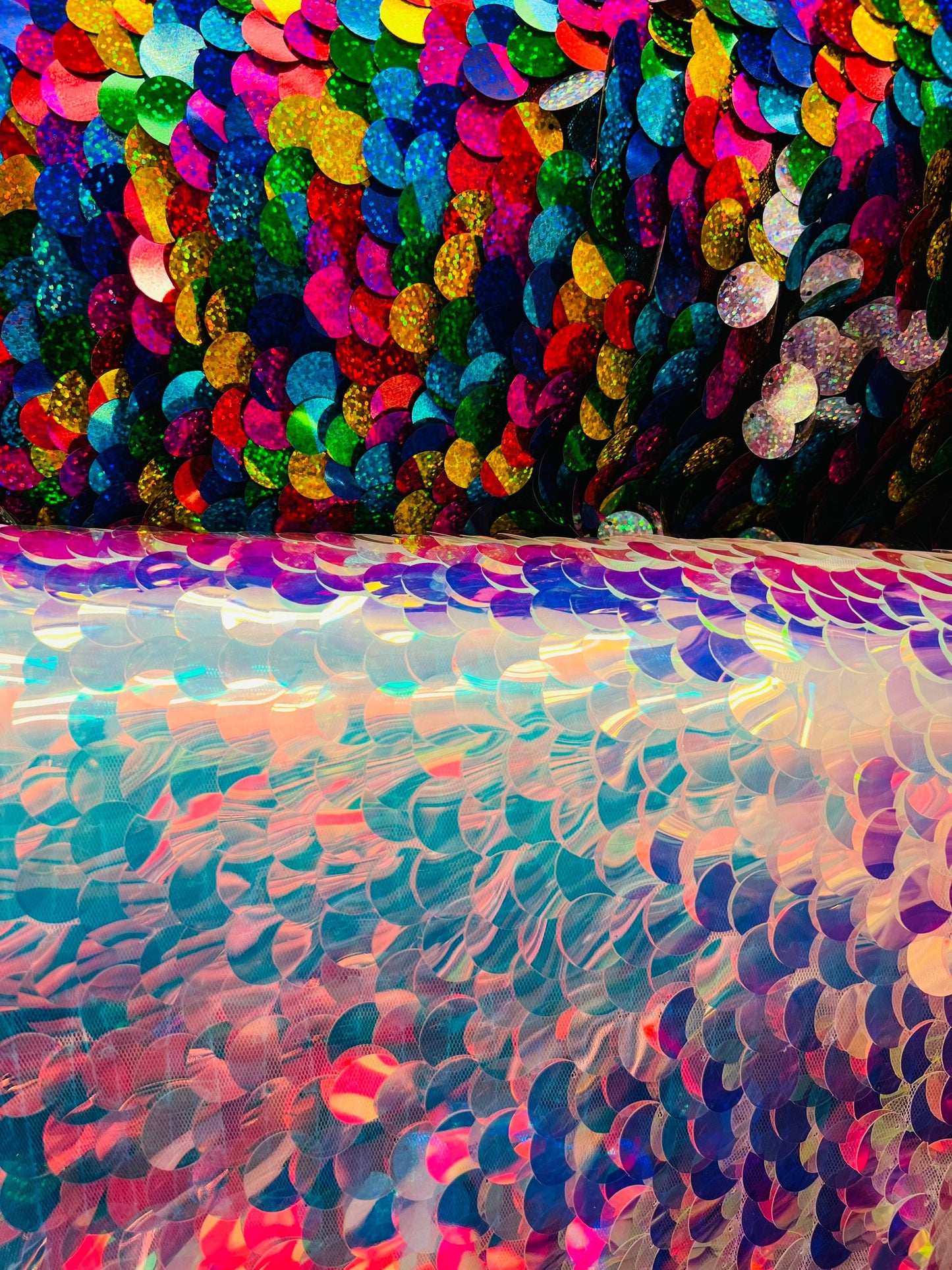 Paillette circle white iridescent and multi color sequins on stretch mesh base. Sold by the yd ships worldwide