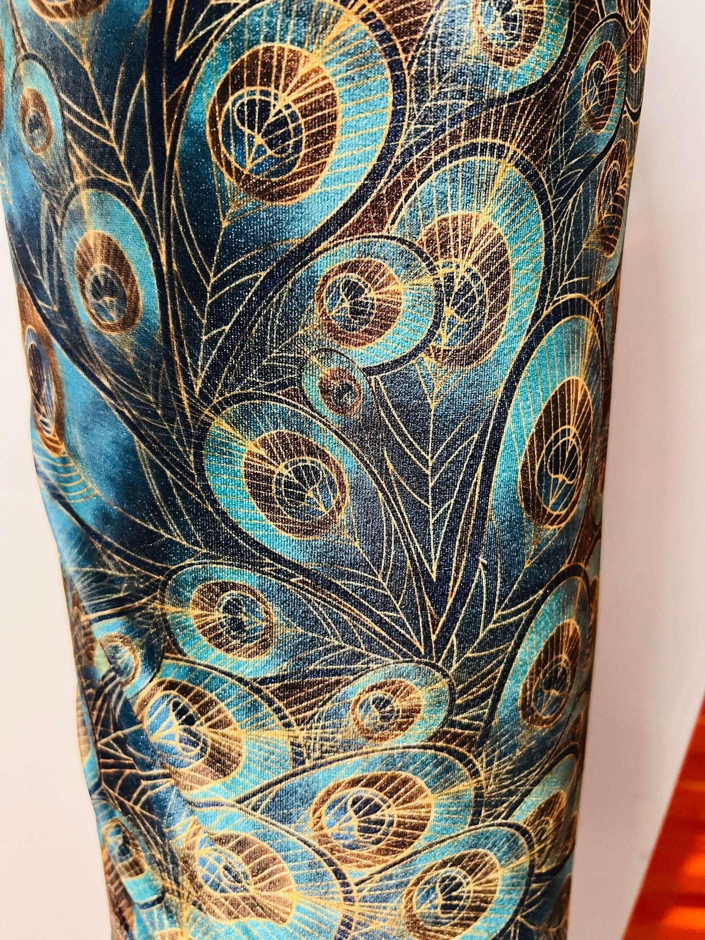 Peacock design New print in stock  Teal blue/Gold print on great quality of stretch velvet4-way stretch 58/60” Sold by the YD.