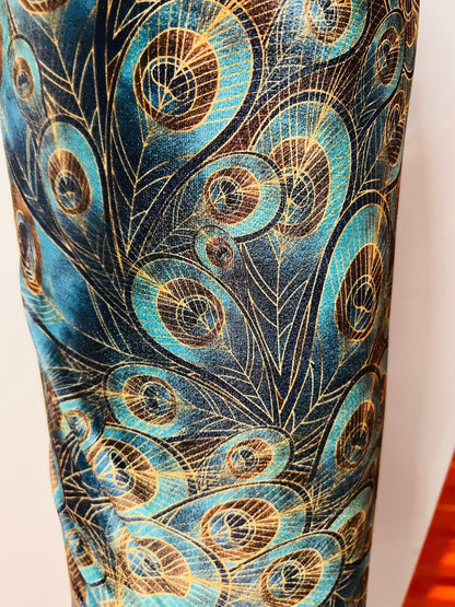 Peacock design New print in stock  Teal blue/Gold print on great quality of stretch velvet4-way stretch 58/60” Sold by the YD.