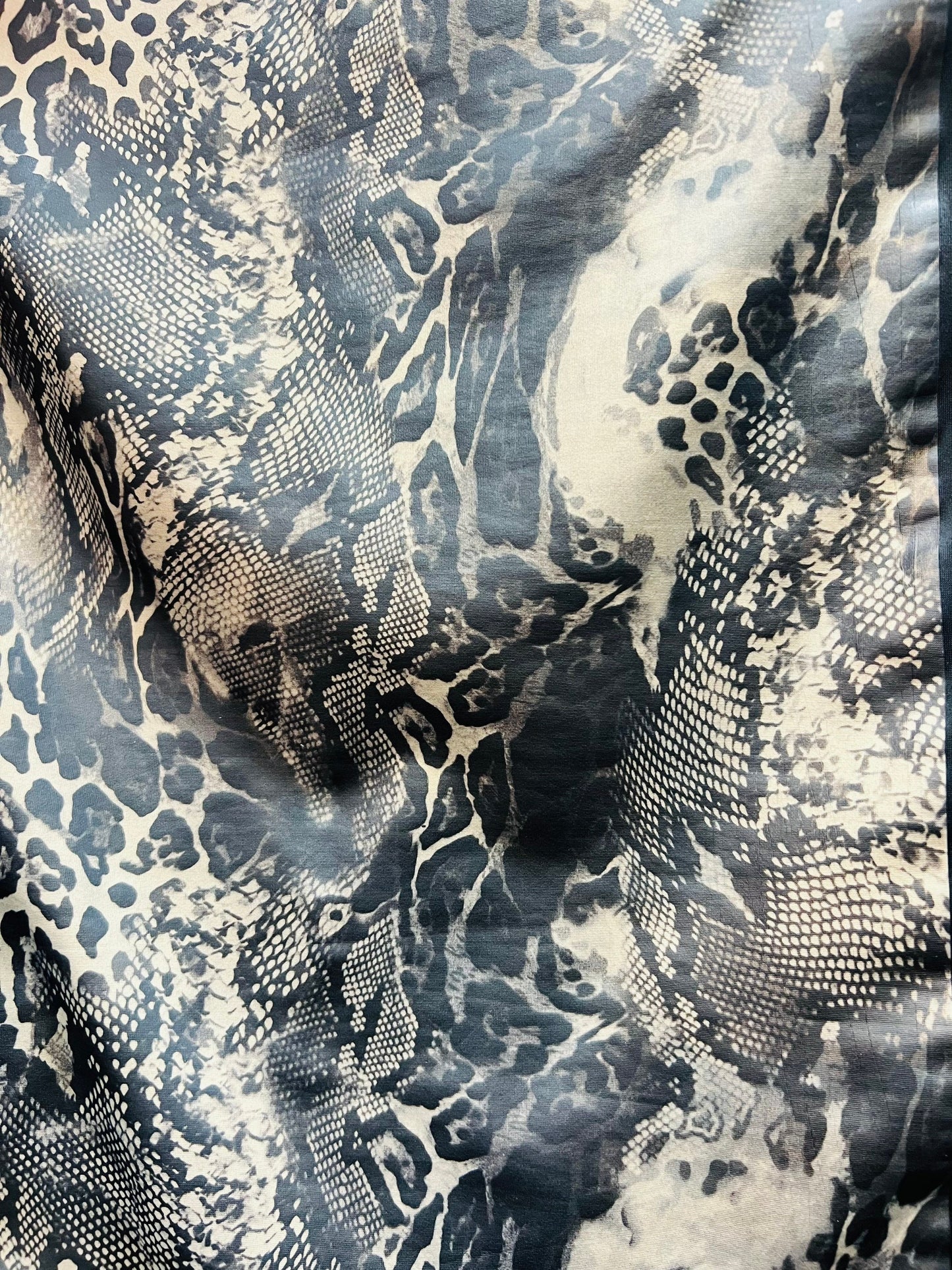 Exotic Multi Animal print on great quality of poly spandex with lame matte foil 2-way stretch 58/60” Sold by the YD.