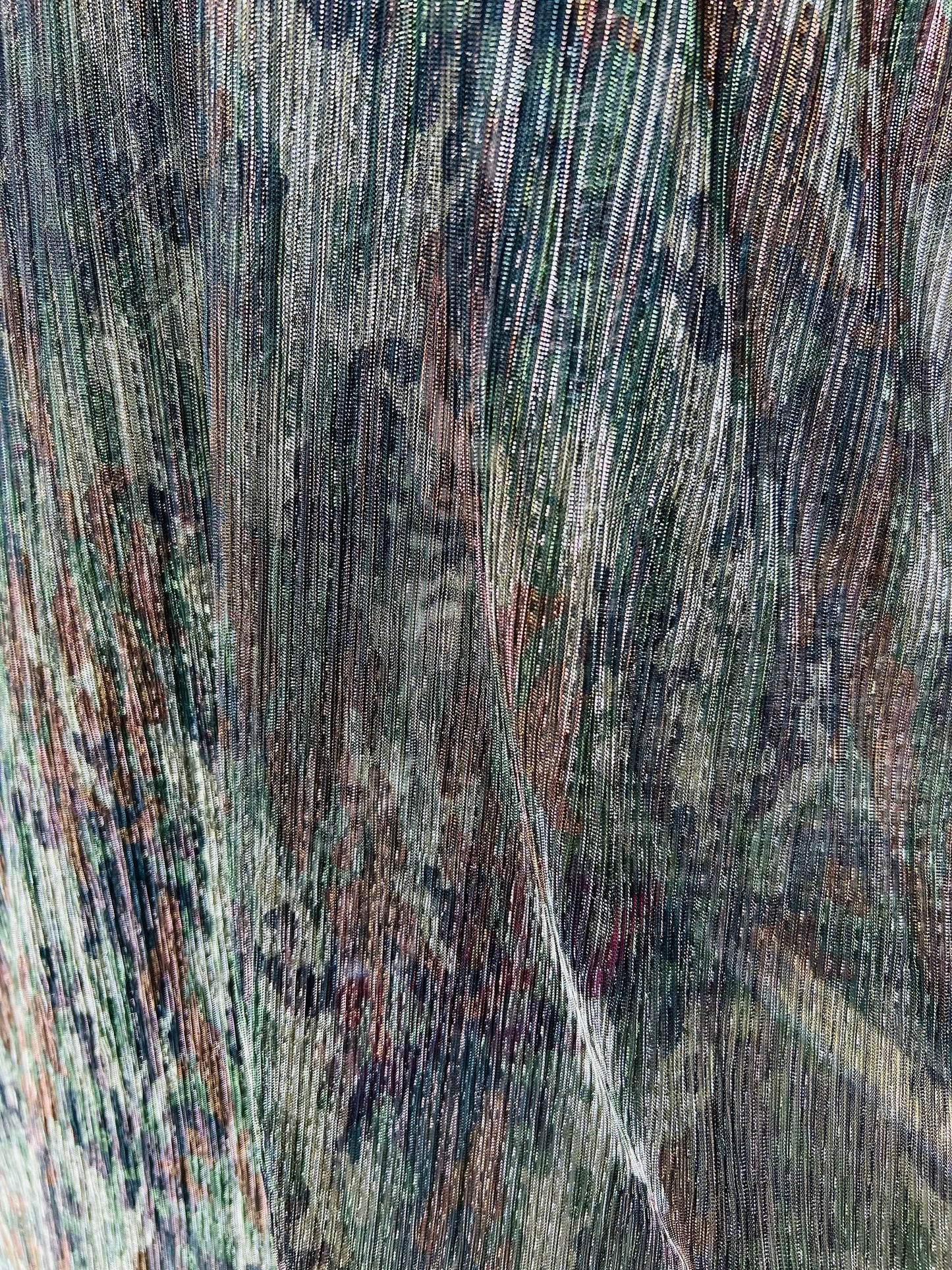 New camouflage design print on metallic mesh pleated 2-way stretch 58/60” Sold by the YD. Ships Worldwide from Los Angeles California USA.