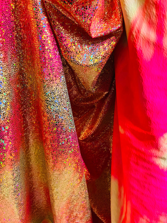Hologram pebbles design metallic tie dye nylon spandex with foil 4-way stretch 58/60” Sold by the YD. Ships Worldwide from Los Ángeles CA