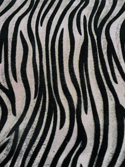 Exotic Zebra design flocked stretch mesh 4-way black/black 58/60” Sold by the YD. Ships Worldwide from Los Angeles California USA