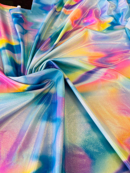 Multi pastel tie dye nylon spandex print on best quality of 4-way metallic spandex 58/60” Sold by the YD.