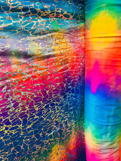Tie dye Hologram metallic foil on nylon spandex 4way stretch 58/60" Sold by the YD. Ships worldwide from Los Angeles California USA