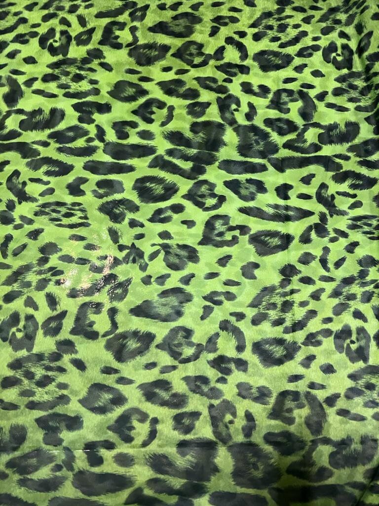 Exotic Leopard design Green/Black print on great quality of power mesh nylon spandex 4-way stretch 58/60” Sold by the YD.