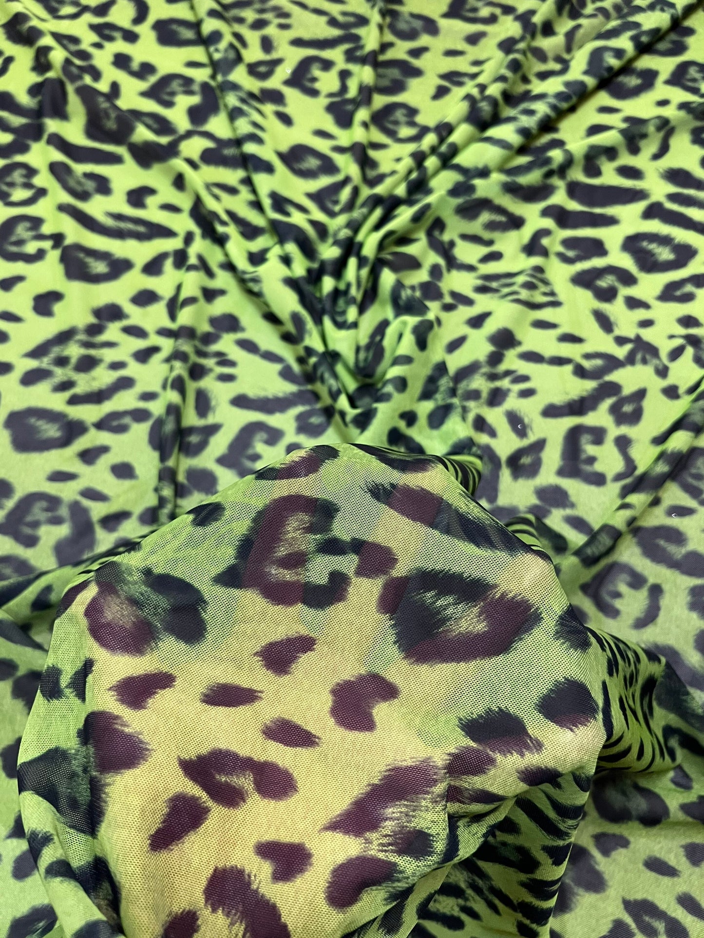 Exotic Leopard design Green/Black print on great quality of power mesh nylon spandex 4-way stretch 58/60” Sold by the YD.