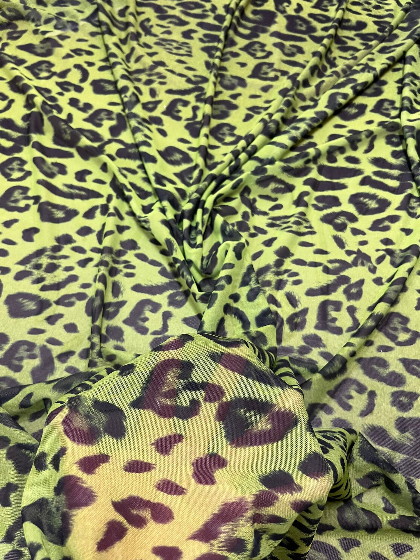Exotic Leopard design Green/Black print on great quality of power mesh nylon spandex 4-way stretch 58/60” Sold by the YD.