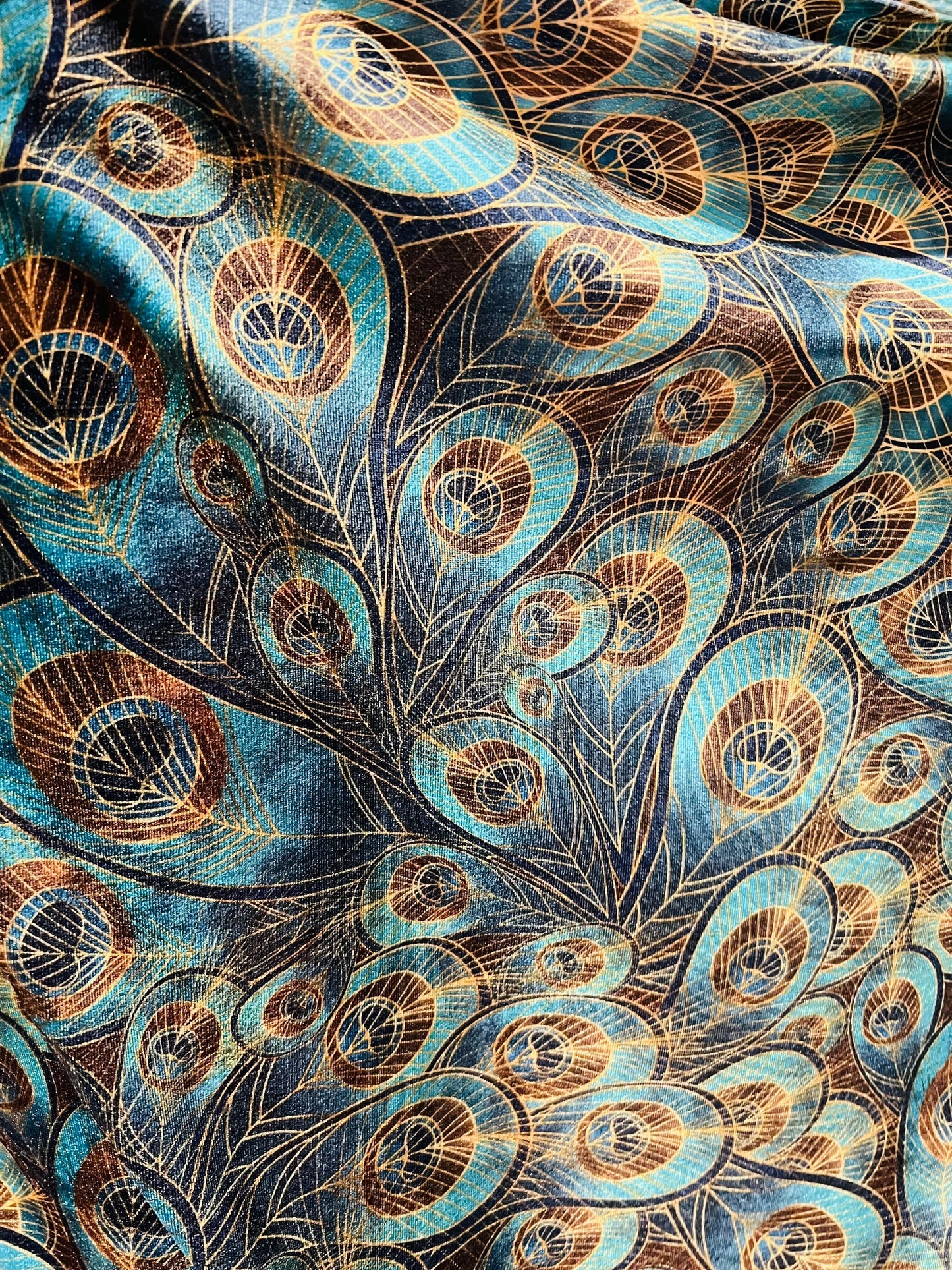 Peacock design New print in stock  Teal blue/Gold print on great quality of stretch velvet4-way stretch 58/60” Sold by the YD.