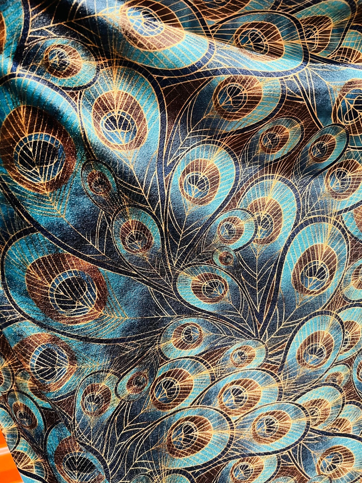 Peacock design New print in stock  Teal blue/Gold print on great quality of stretch velvet4-way stretch 58/60” Sold by the YD.