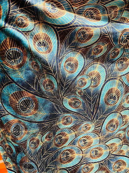 Peacock design New print in stock  Teal blue/Gold print on great quality of stretch velvet4-way stretch 58/60” Sold by the YD.