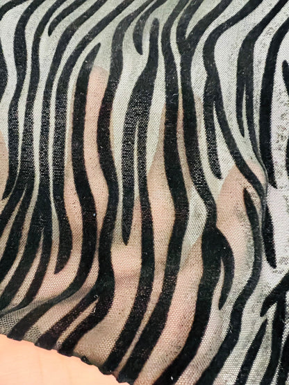 Exotic Zebra design flocked stretch mesh 4-way black/black 58/60” Sold by the YD. Ships Worldwide from Los Angeles California USA