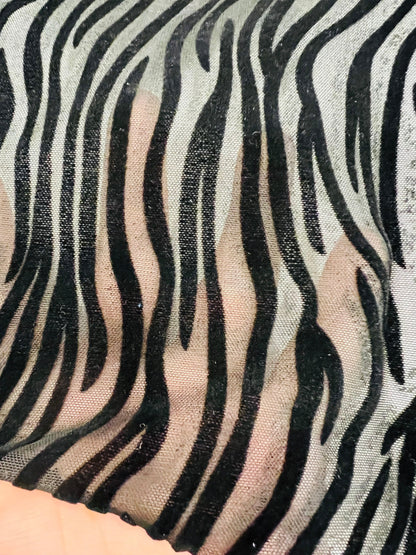 Exotic Zebra design flocked stretch mesh 4-way black/black 58/60” Sold by the YD. Ships Worldwide from Los Angeles California USA