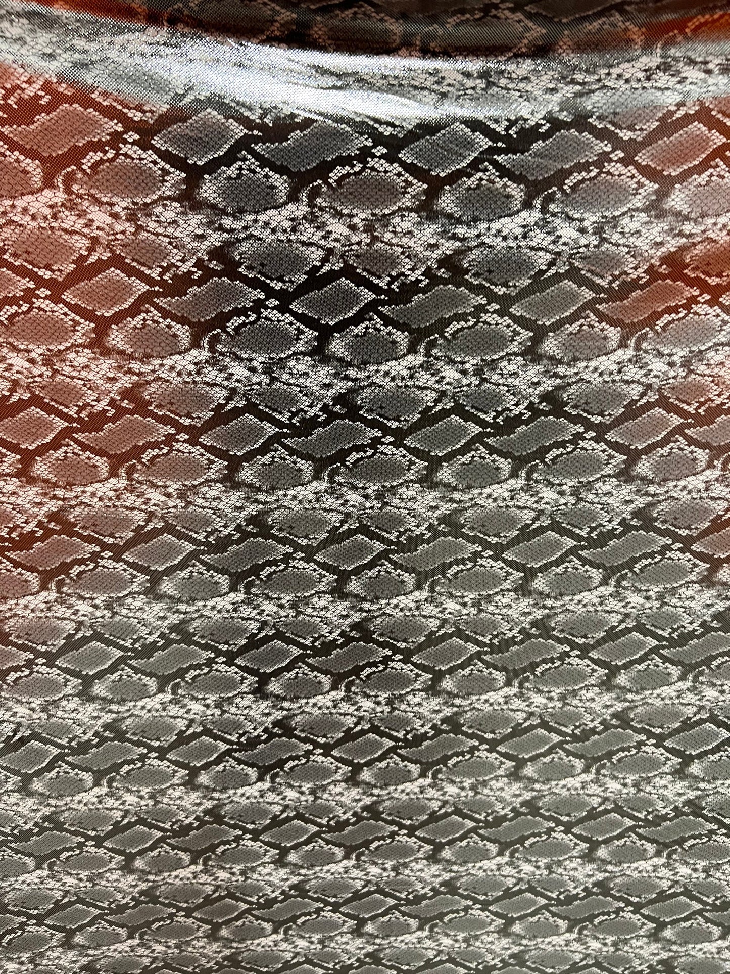 Exotic snake design gray/silver hologram metallic nylon spandex light weight 2-way stretch 58/60” Sold by the YD. Ships worldwide from LA