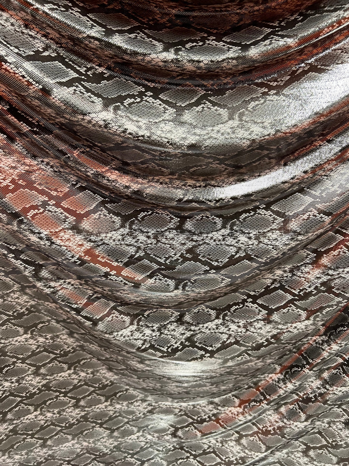 Exotic snake design gray/silver hologram metallic nylon spandex light weight 2-way stretch 58/60” Sold by the YD. Ships worldwide from LA