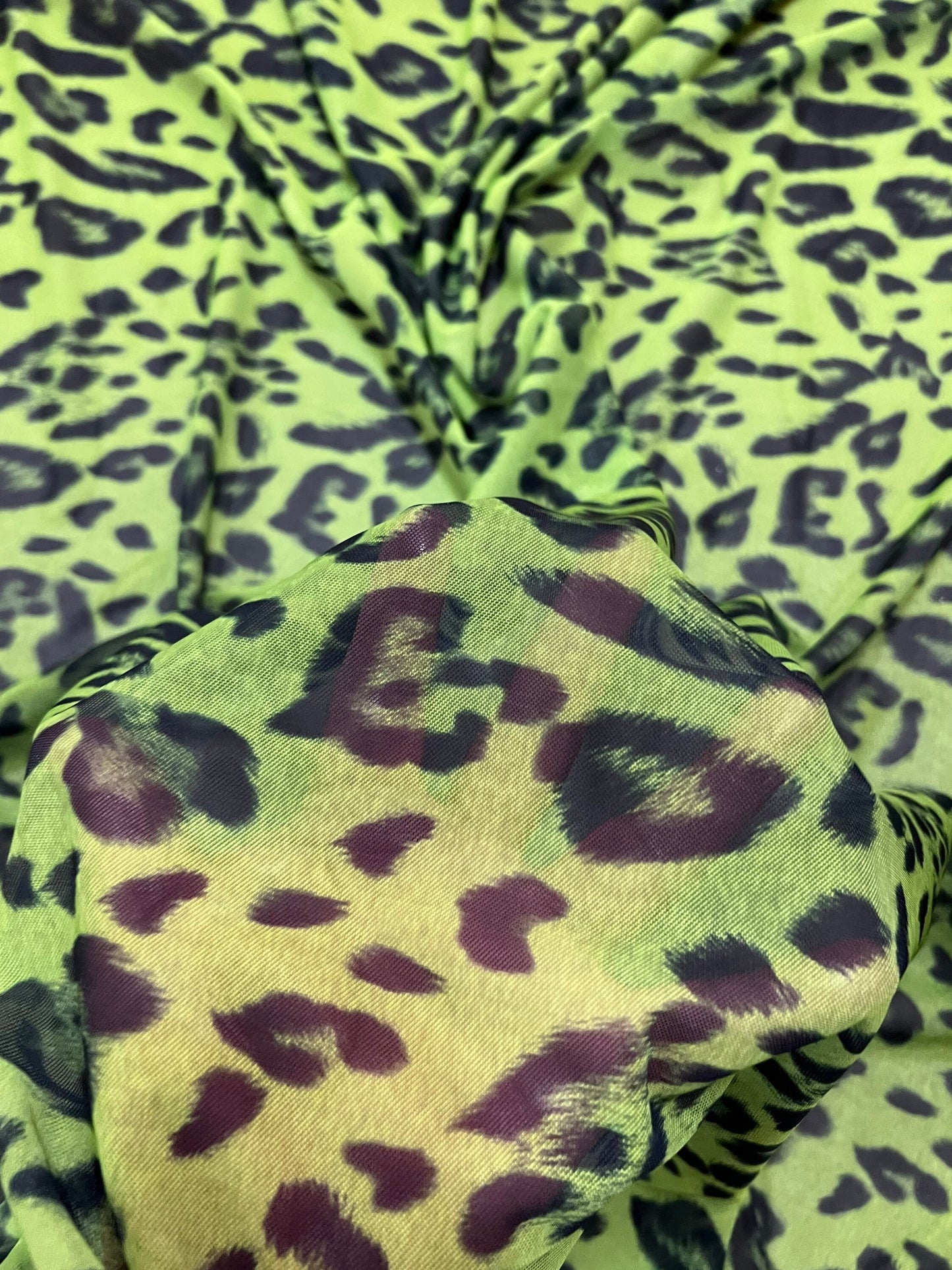Exotic Leopard design Green/Black print on great quality of power mesh nylon spandex 4-way stretch 58/60” Sold by the YD.