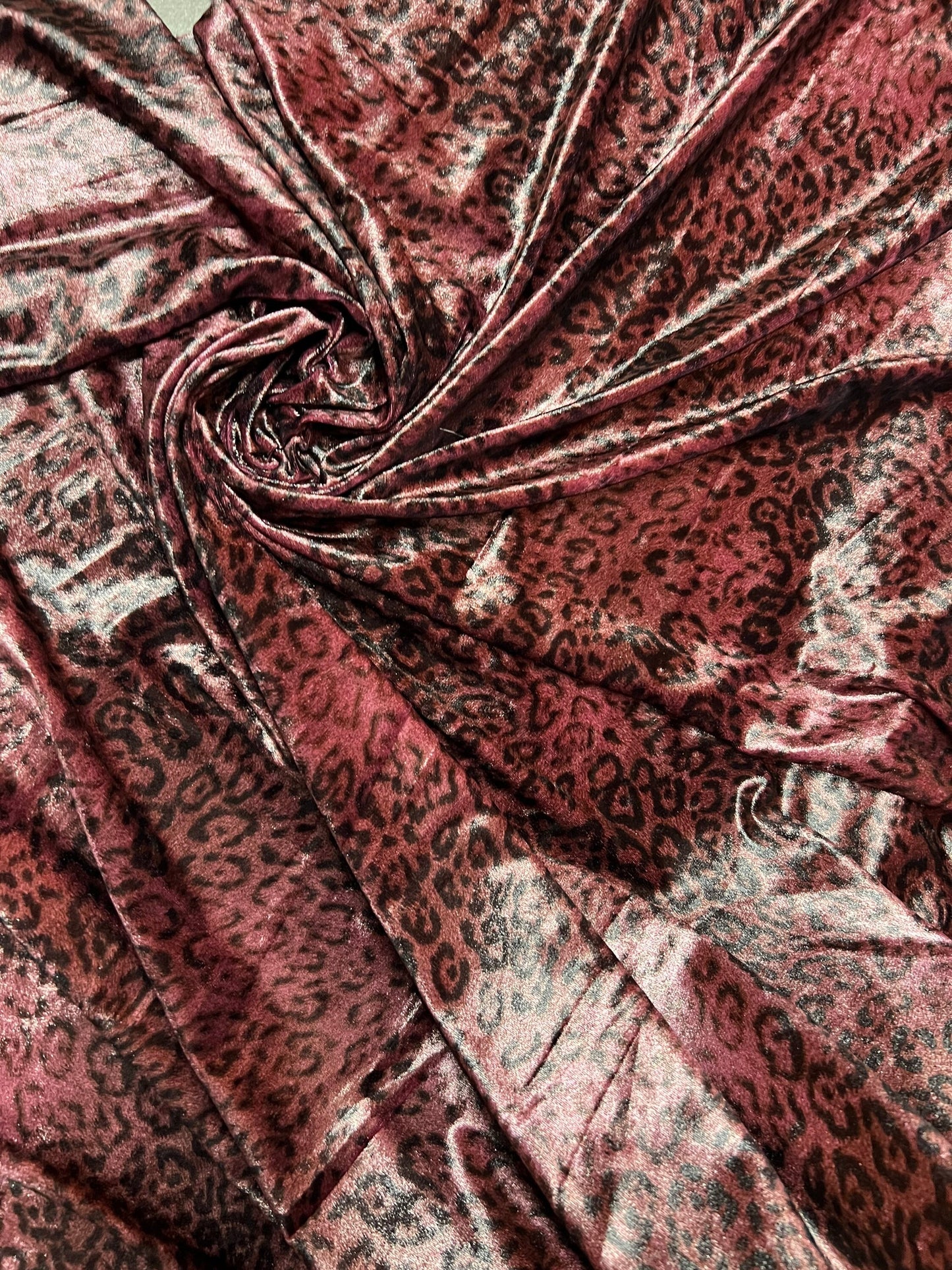 New Exotic Leopard design Mauve/Black print on great quality of stretch velvet 4-way stretch 58/60” Sold by the YD.