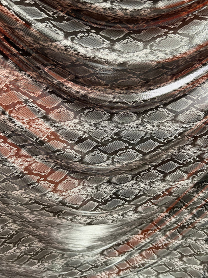 Exotic snake design gray/silver hologram metallic nylon spandex light weight 2-way stretch 58/60” Sold by the YD. Ships worldwide from LA