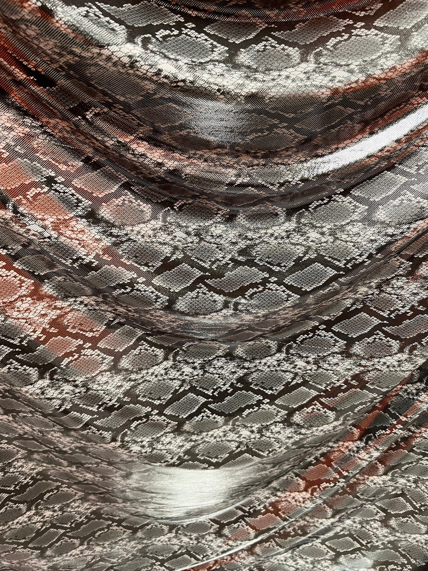 Exotic snake design gray/silver hologram metallic nylon spandex light weight 2-way stretch 58/60” Sold by the YD. Ships worldwide from LA
