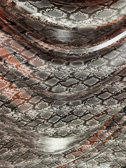 Exotic snake design gray/silver hologram metallic nylon spandex light weight 2-way stretch 58/60” Sold by the YD. Ships worldwide from LA