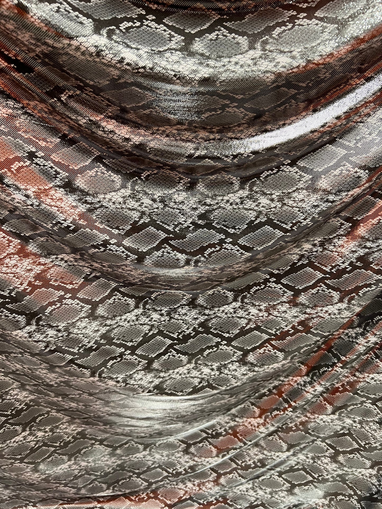 Exotic snake design gray/silver hologram metallic nylon spandex light weight 2-way stretch 58/60” Sold by the YD. Ships worldwide from LA