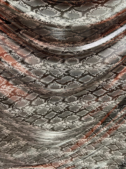 Exotic snake design gray/silver hologram metallic nylon spandex light weight 2-way stretch 58/60” Sold by the YD. Ships worldwide from LA
