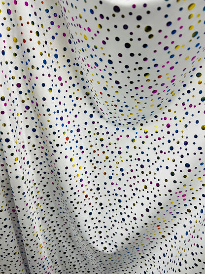 Metallic polka dots design white/multicolor hologram nylon spandex 4-way stretch 58/60” Sold by the YD. Ships Worldwide from Los Angeles CA