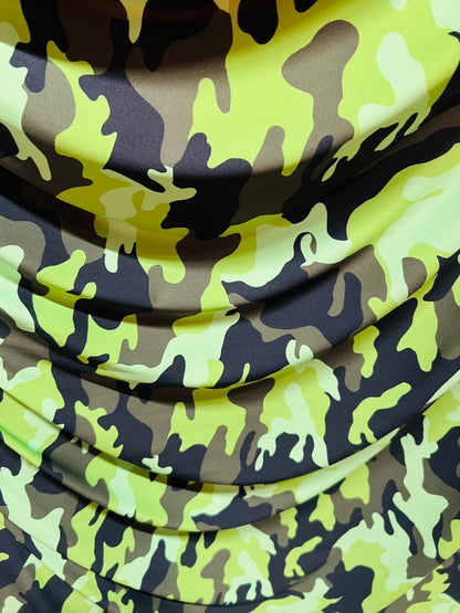 Camouflage design neon green/multi print on great quality of nylon spandex medium weight 4-way stretch 58/60” Sold by the YD.