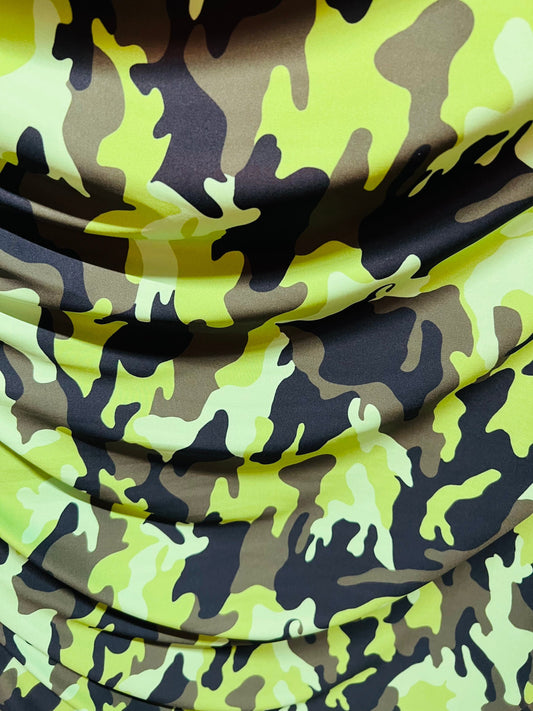 Camouflage design neon green/multi print on great quality of nylon spandex medium weight 4-way stretch 58/60” Sold by the YD.