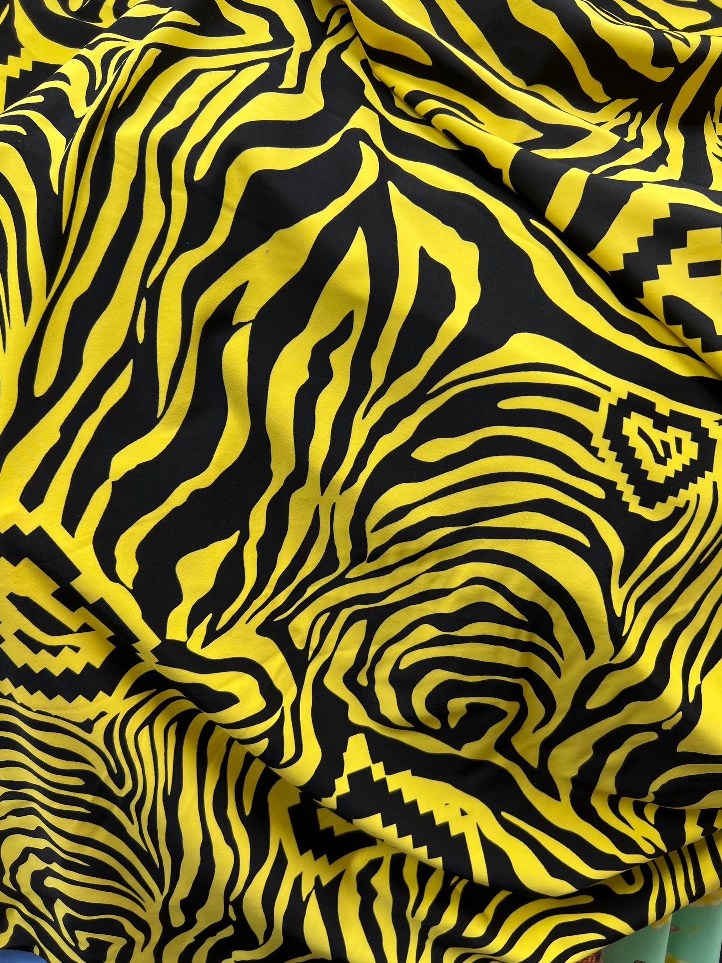 Exotic zebra design black/yellow print on nylon spandex 4way stretch 58/60” Sold by the YD. Ships worldwide from Los Angeles California USA.