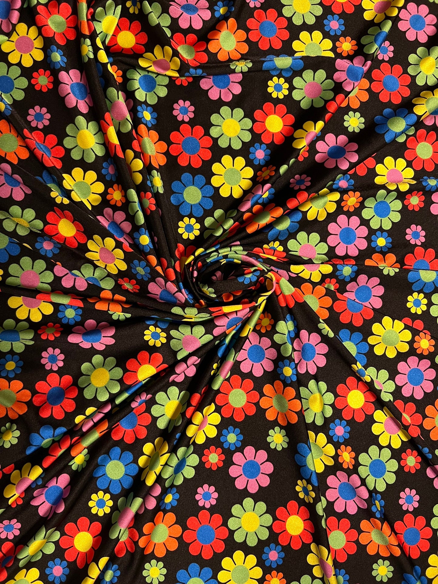 New daisy flower design Black/Multicolor print on great quality of nylon spandex 4-way stretch 58/60” Sold by the YD.