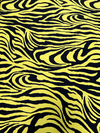 Exotic Zebra design yellow/black print on great quality of poly spandex 4-way stretch 58/60” Sold by the YD. Ships Worldwide from L.A CA