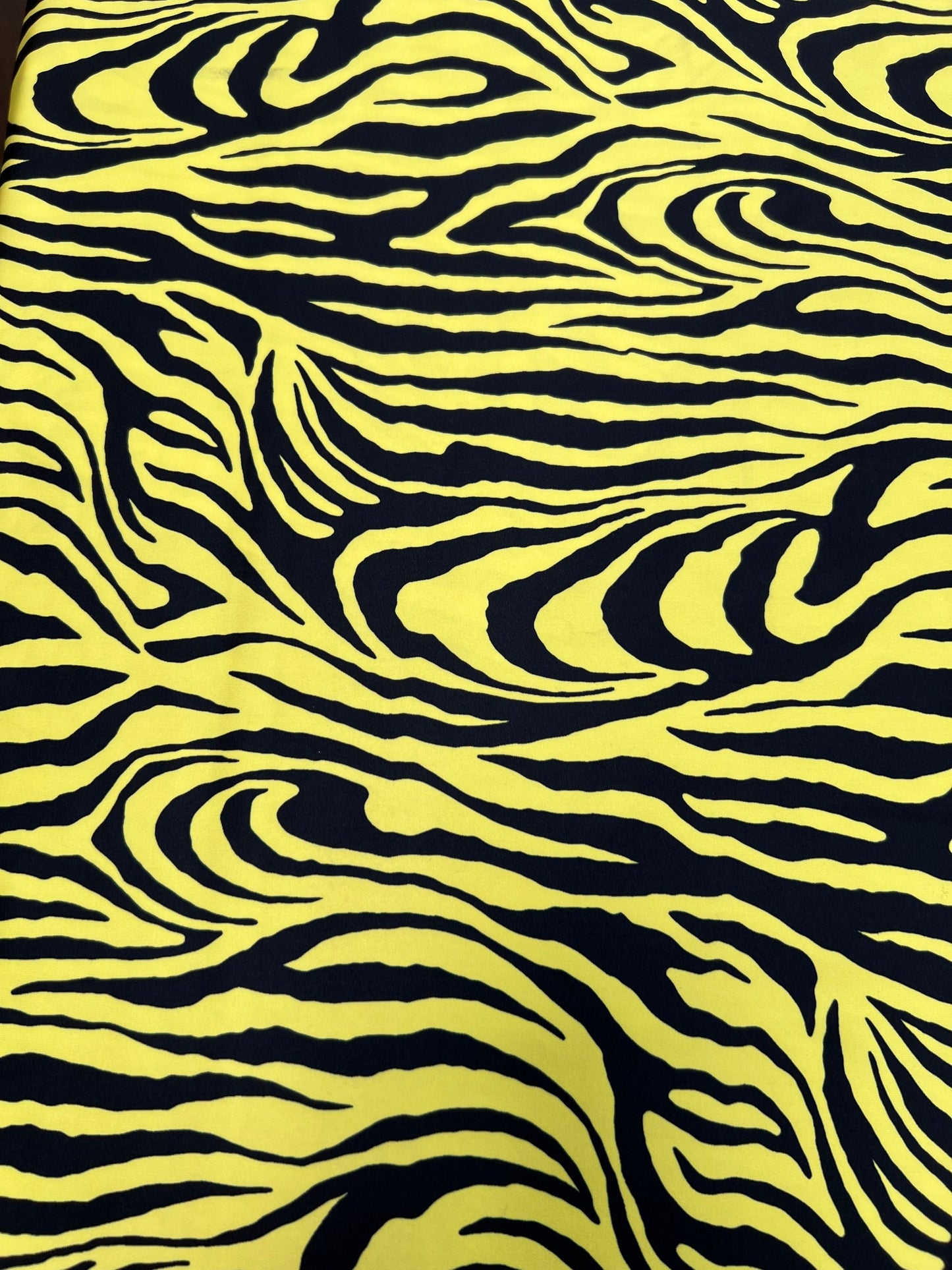 Exotic Zebra design yellow/black print on great quality of poly spandex 4-way stretch 58/60” Sold by the YD. Ships Worldwide from L.A CA