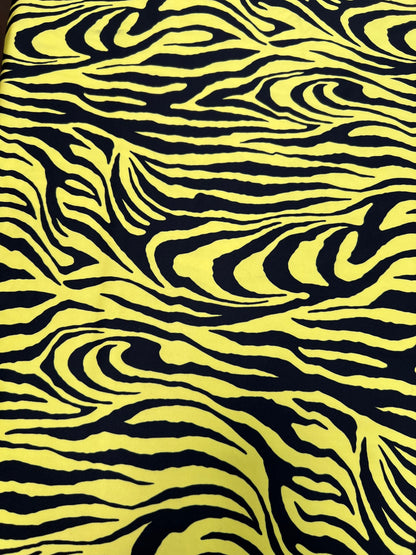 Exotic Zebra design yellow/black print on great quality of poly spandex 4-way stretch 58/60” Sold by the YD. Ships Worldwide from L.A CA