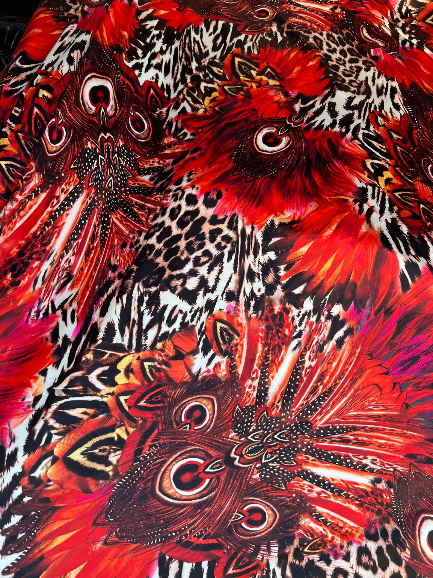Hiding Leopard & Peacock design exotic animal print on yoga poly spandex 4-way stretch 58/60” Sold by the YD. Ships Worldwide