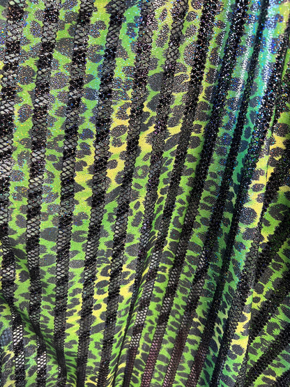 Exotic Leopard design print on nylon fish net with metallic glitter 4-way stretch 58/60” Sold by the YD. Ships Worldwide from Los Angeles CA